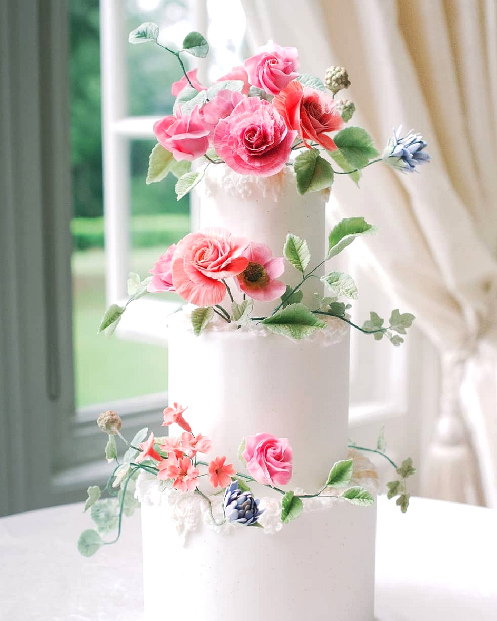 European wedding cake with sugar flowers and vine accents