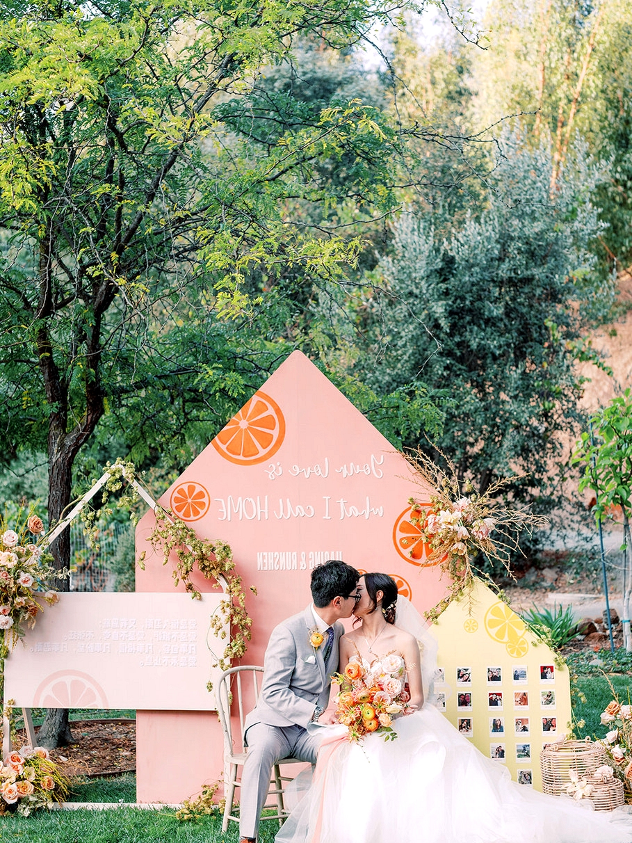 orange fruit wedding decor backdrop