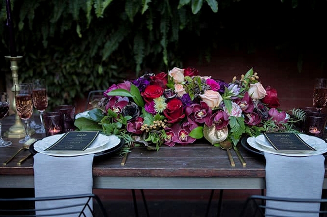 Jewel toned wedding reception centrepiece | Lola Images
