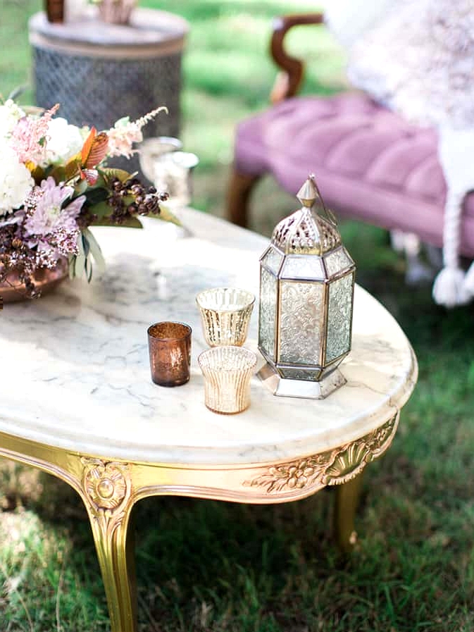 Boho wedding decor on gold and marble coffee table