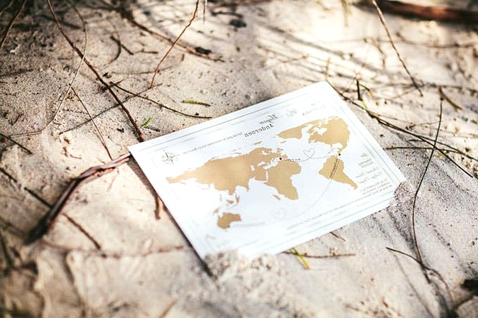World map travel inspired wedding invitation