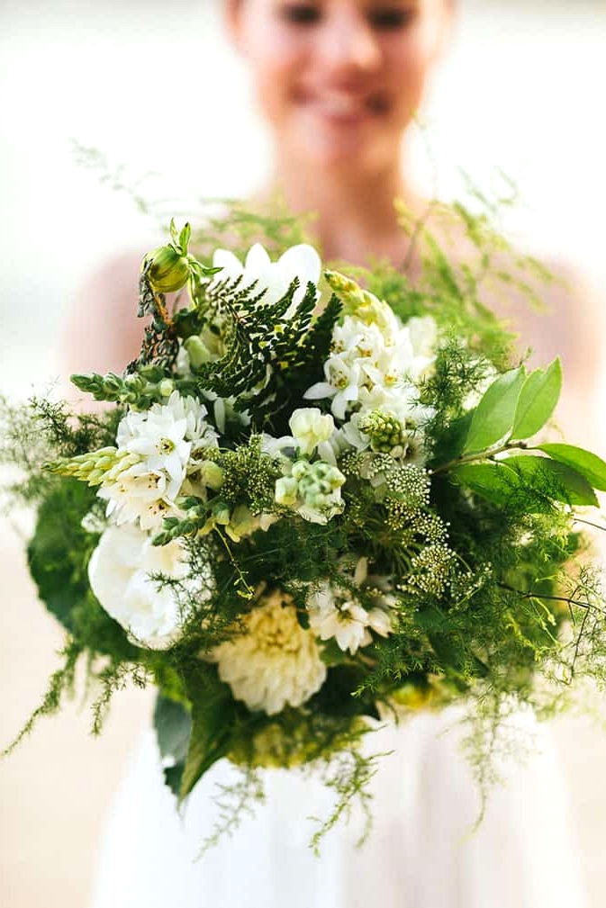 Textured green and white bride bouquet for beach wedding