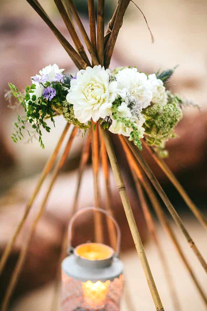 Beach wedding teepee flowers and lantern
