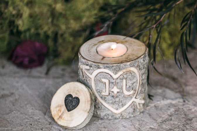 Wood stump candle holder engraved with bride and groom initials