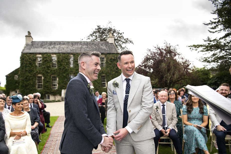 Eoin & Darran Real Wedding guests ceremony happy smiling ivy officiant officiate