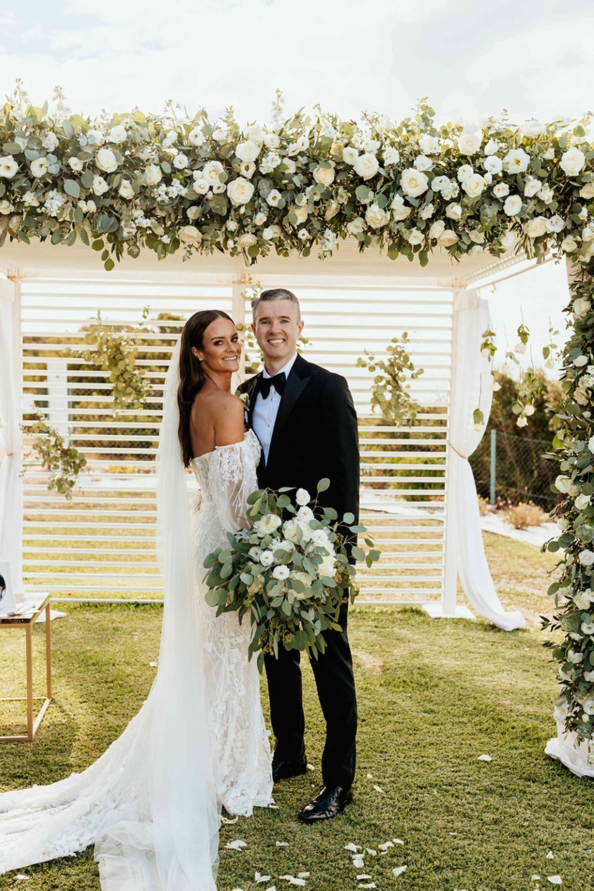 bride and groom portugal wedding floral arch 