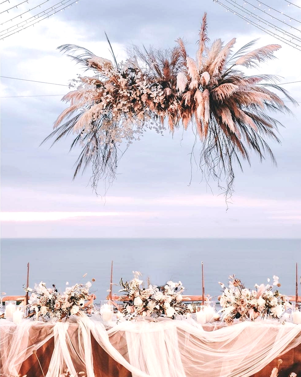 boho wedding table with white gauzy linen