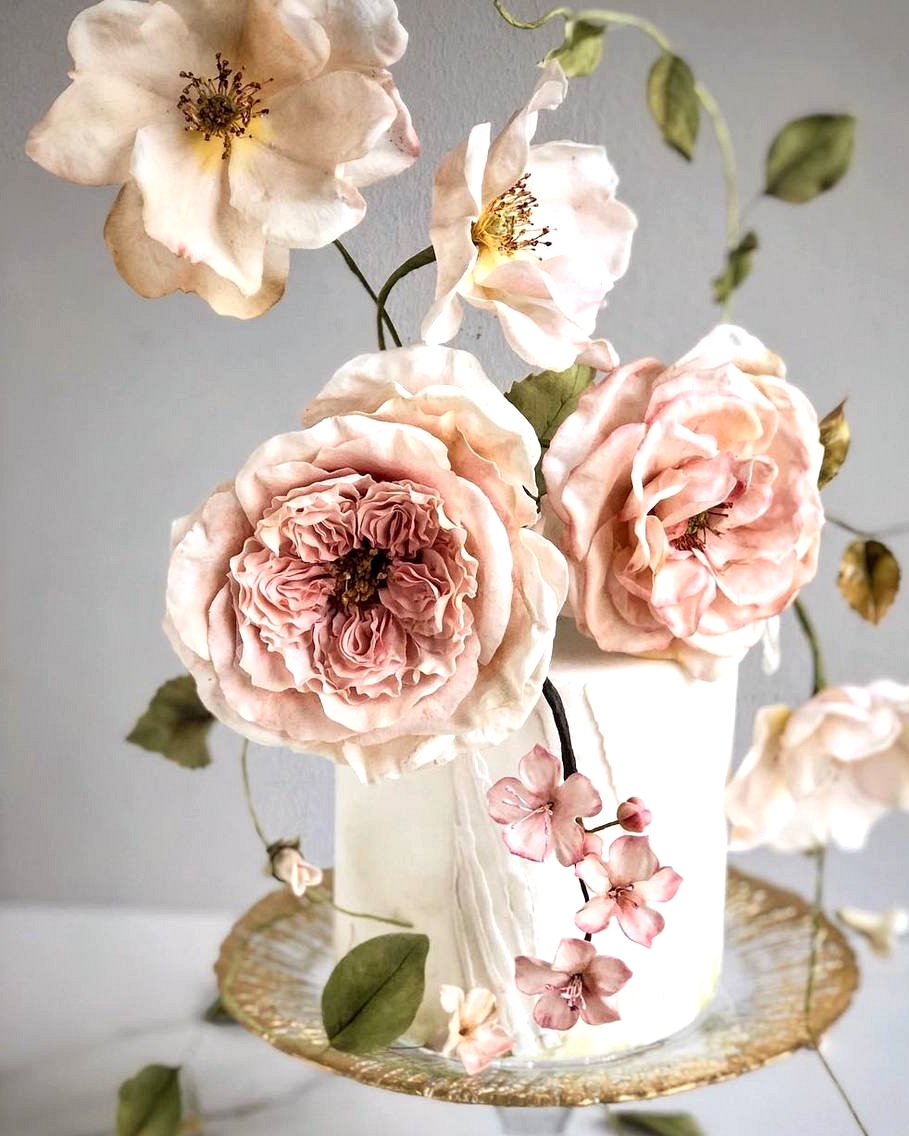 mini garden wedding cake with oversized sugar flowers