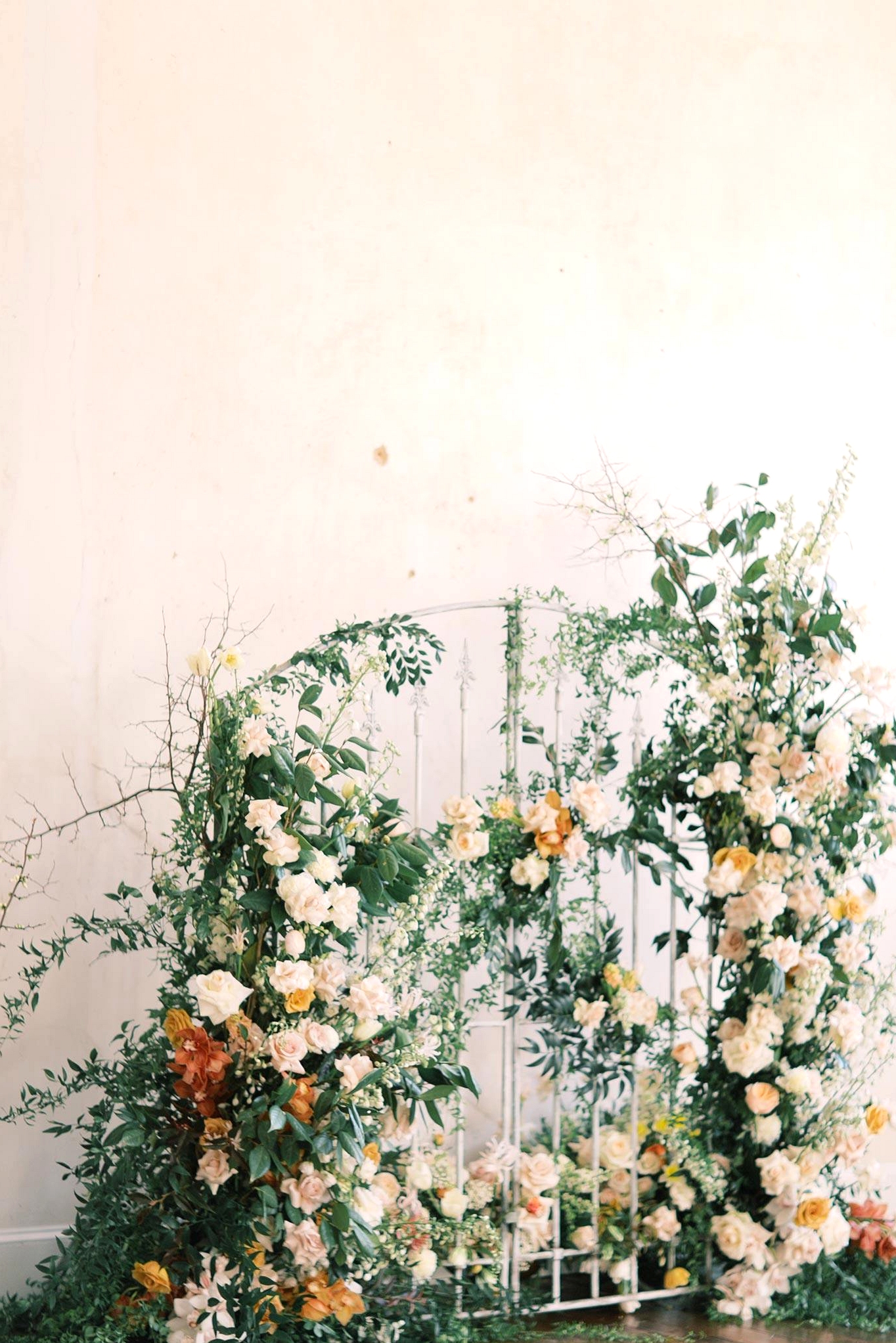 floral iron gate wedding backdrop