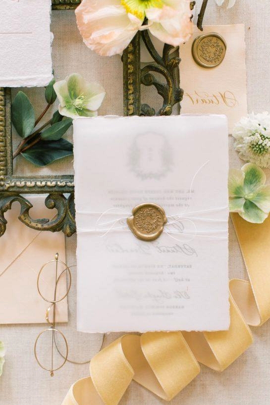 wedding paper goods with brass wax seal and white twine