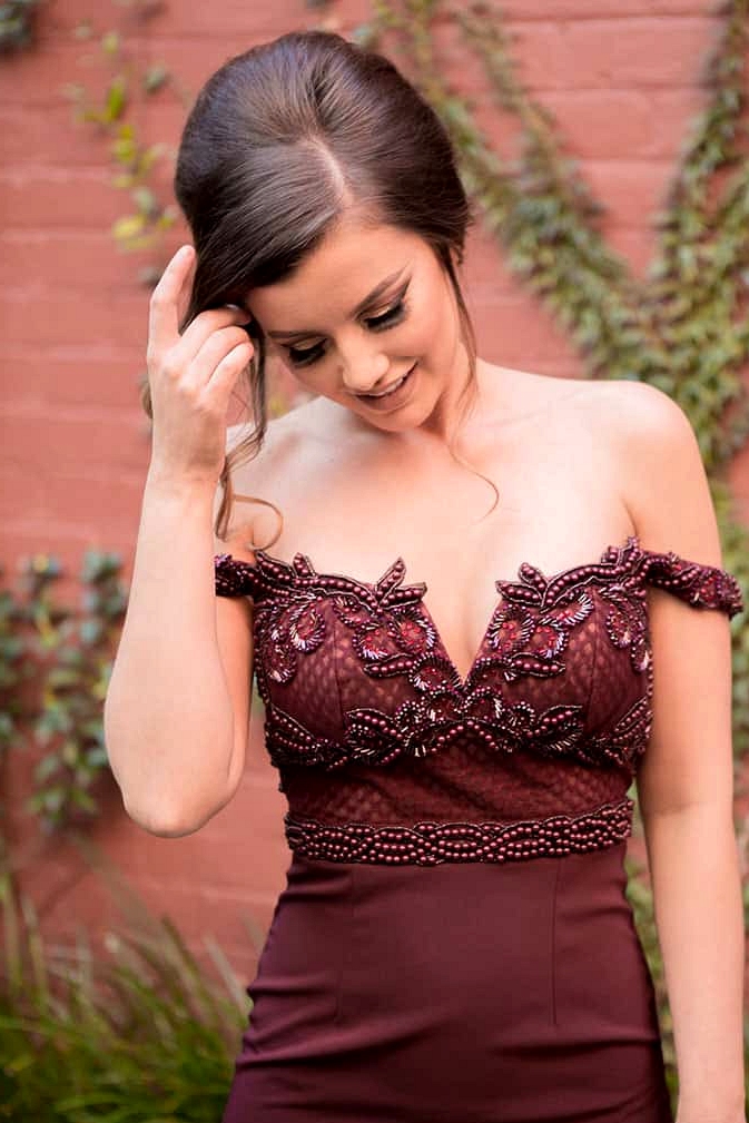 Bridesmaid wearing burgundy off the shoulder dress with beaded bodice | Lola Images