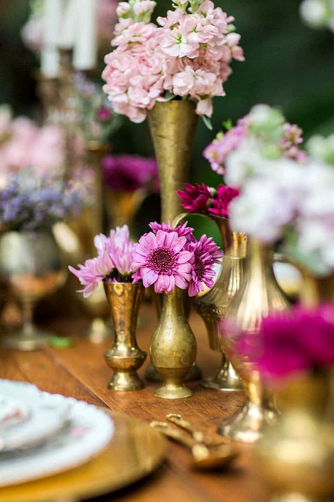 Vintage brass vessels filled with flowers
