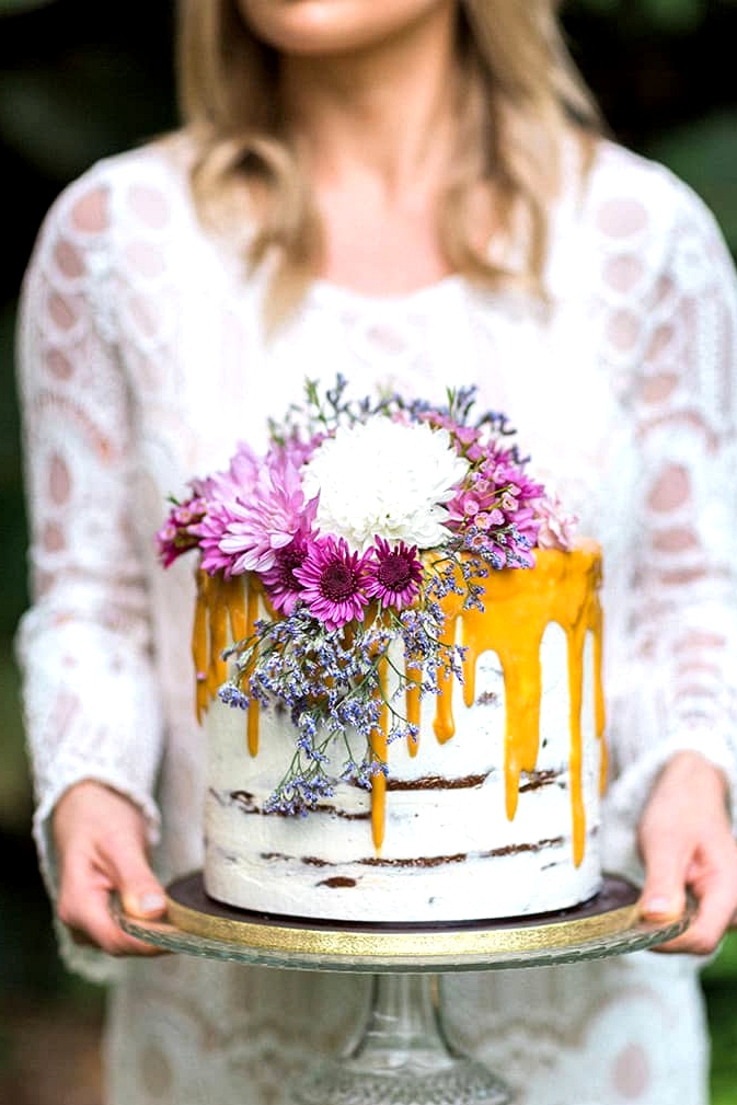 Caramel drip cake with pink floral topper