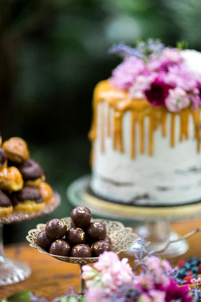 Gold leaf chocolates on a vintage wedding dessert table