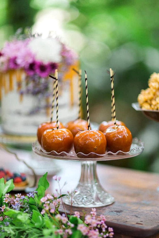 Toffee apples on a vintage wedding dessert table