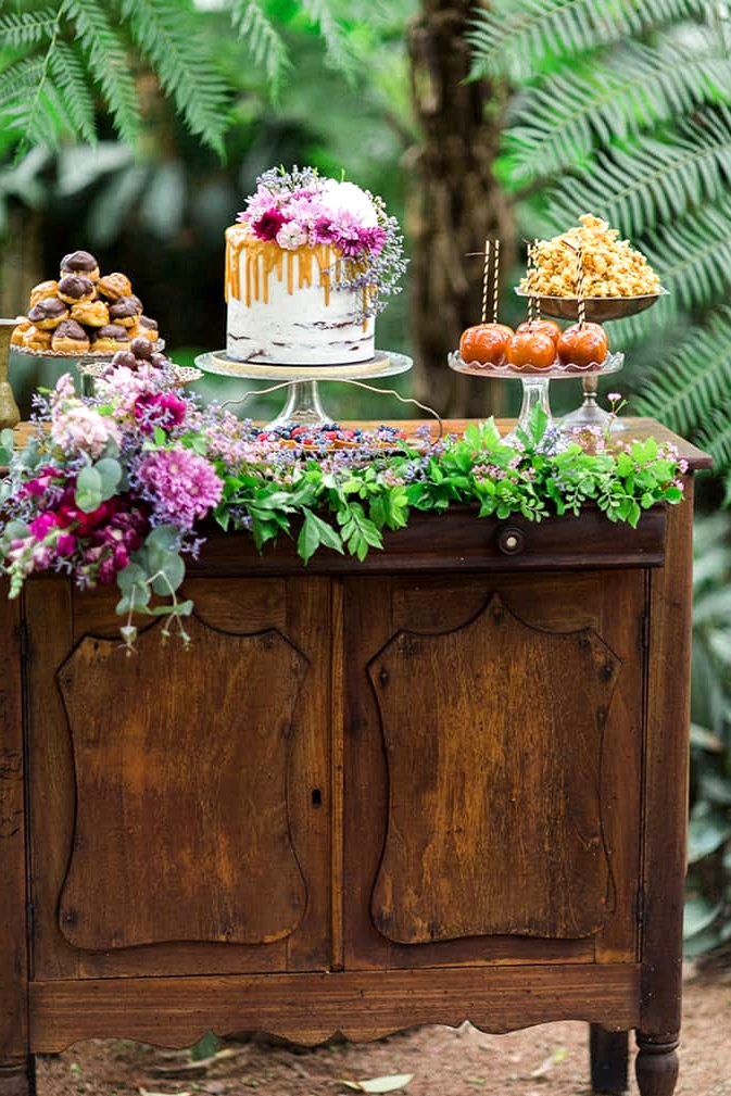 Wedding dessert display on vintage dresser