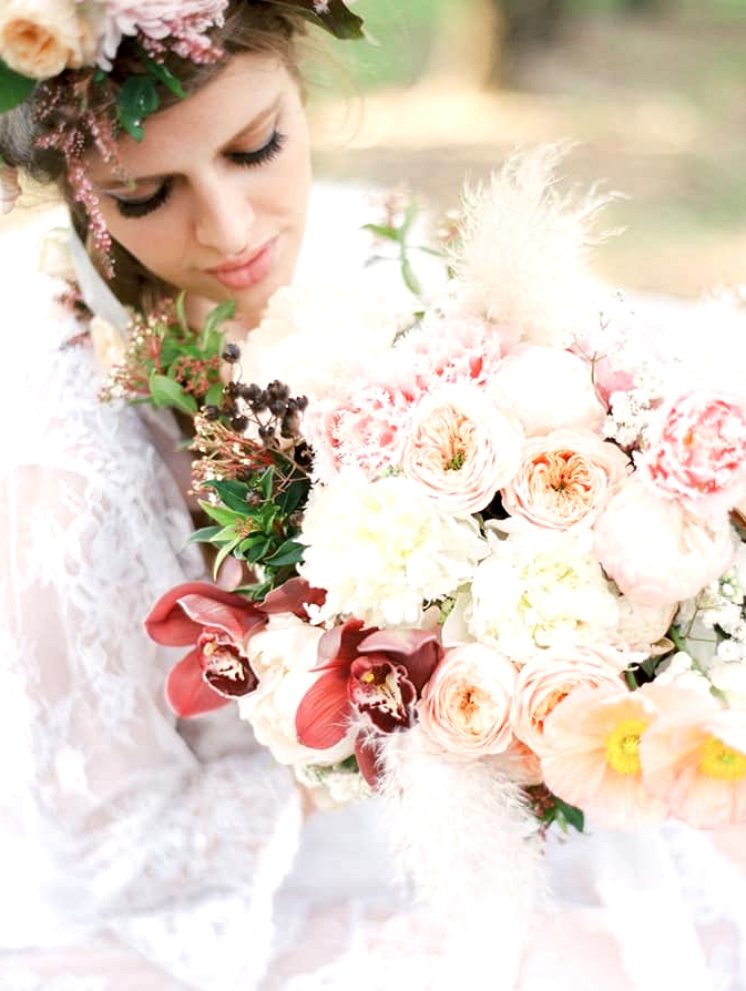 Pastel wedding bouquet with peonies, poppies, orchids and roses