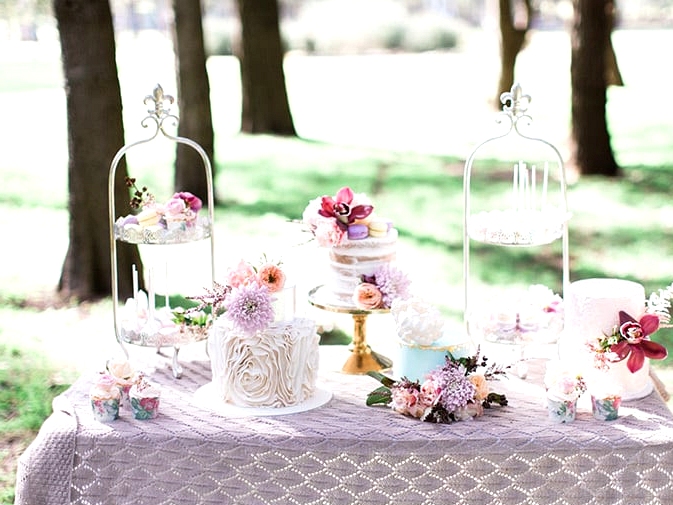 Pastel wedding cake and dessert display