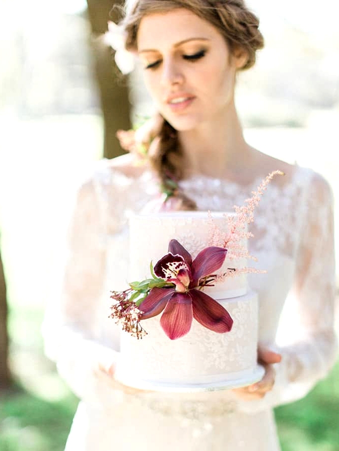 Elegant white wedding cake with orchid detail