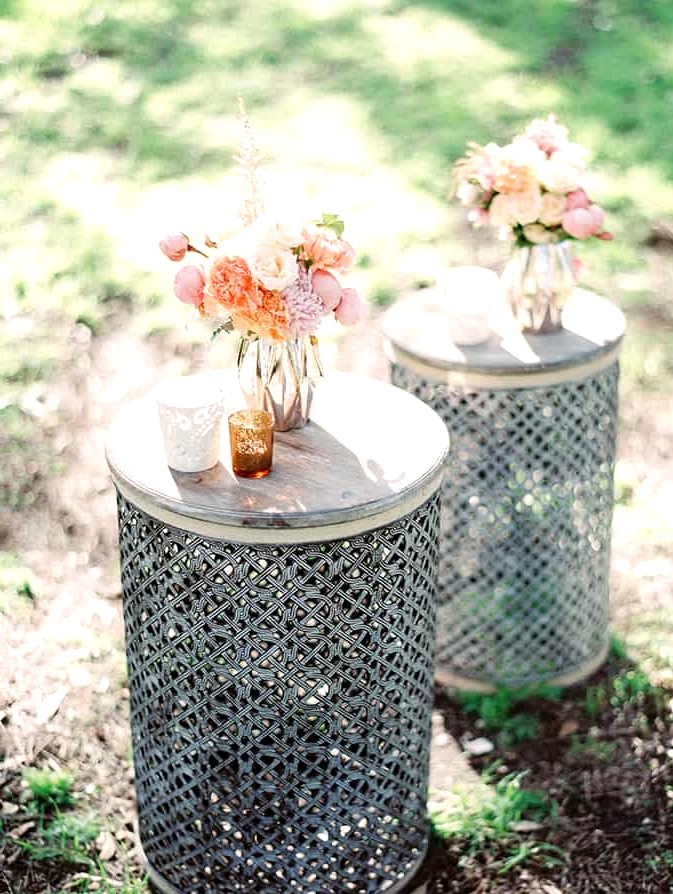 Wedding lounge tables with pastel florals and votives