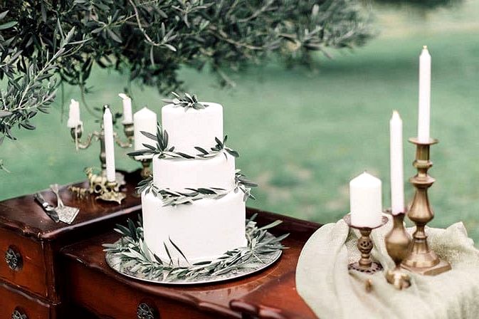 Romantic-Bohemian-Wedding-Inspiration-Olive-Leaf-Cake-Table-Candles