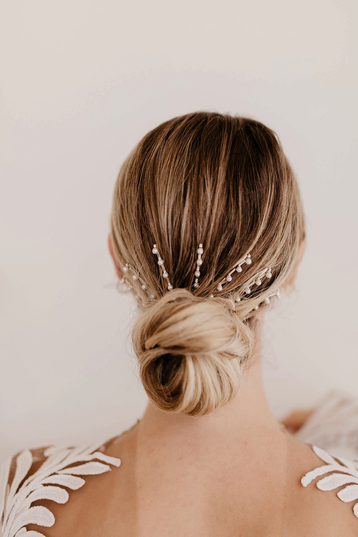 bridal hair ideas, low chignon, pearl pins