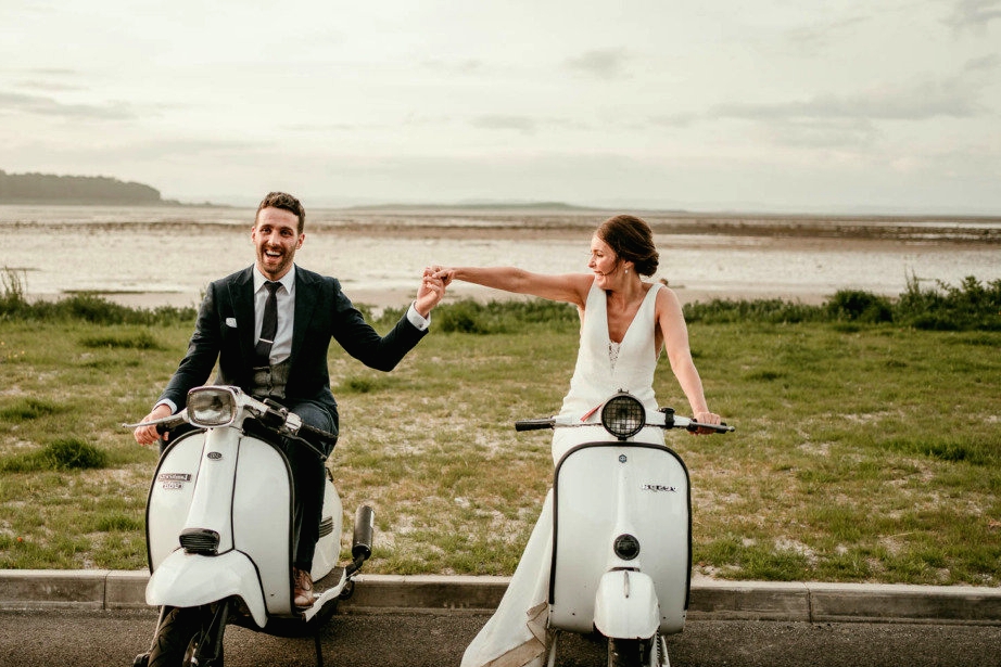 bride and groom on vespas